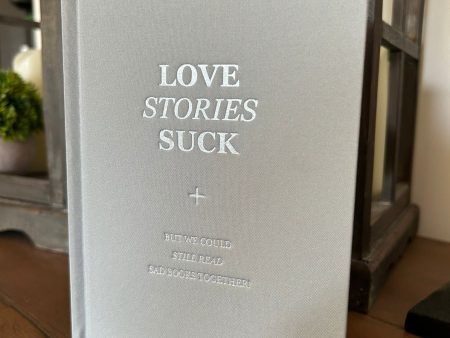 ALL NEW!  LOVE STORIES SUCK  HARDCOVER Sale